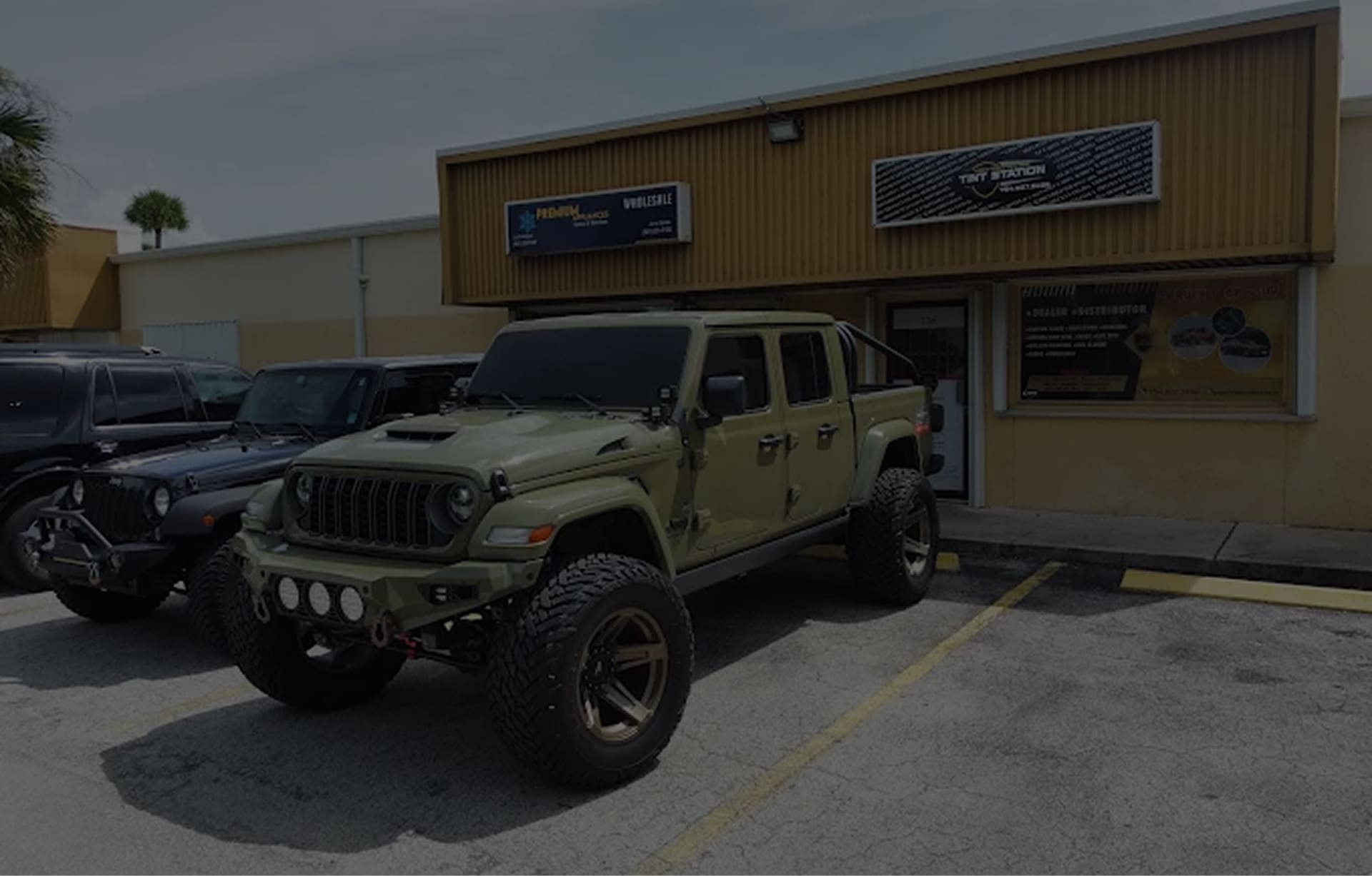 Tint Station technician performing a custom car audio and window tint install