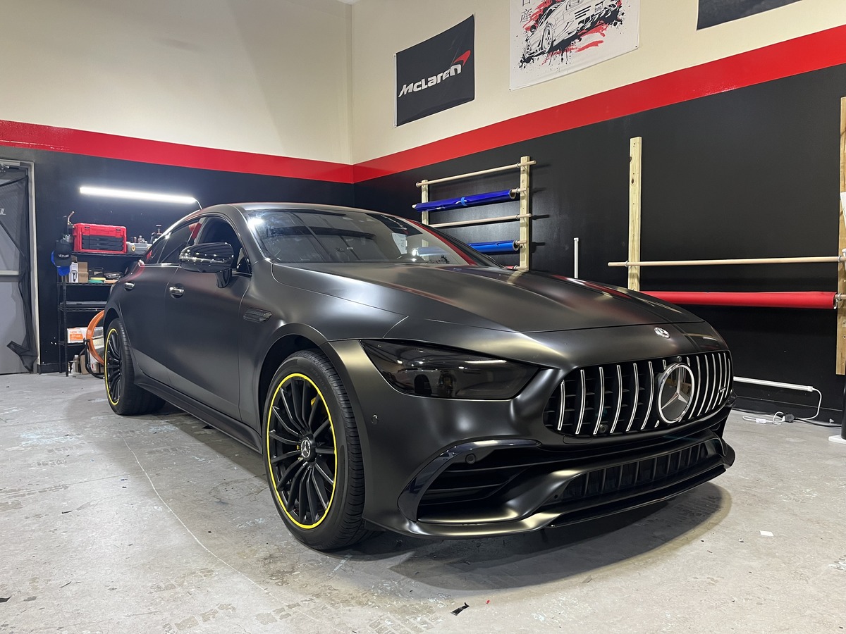 Matte black Mercedes-AMG GT with headlight tint by Tint Station